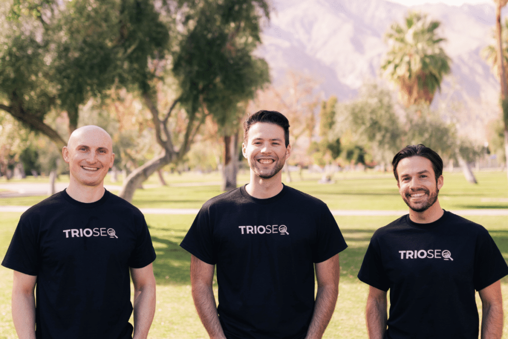 Nathan with Steven and Connor wearing TrioSEO tees outdoors.